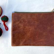 Load image into Gallery viewer, Red striped French linen and upcycled brown leather. 2-material pouch with YKK zip. Zippered purse. Zippered pouch.
