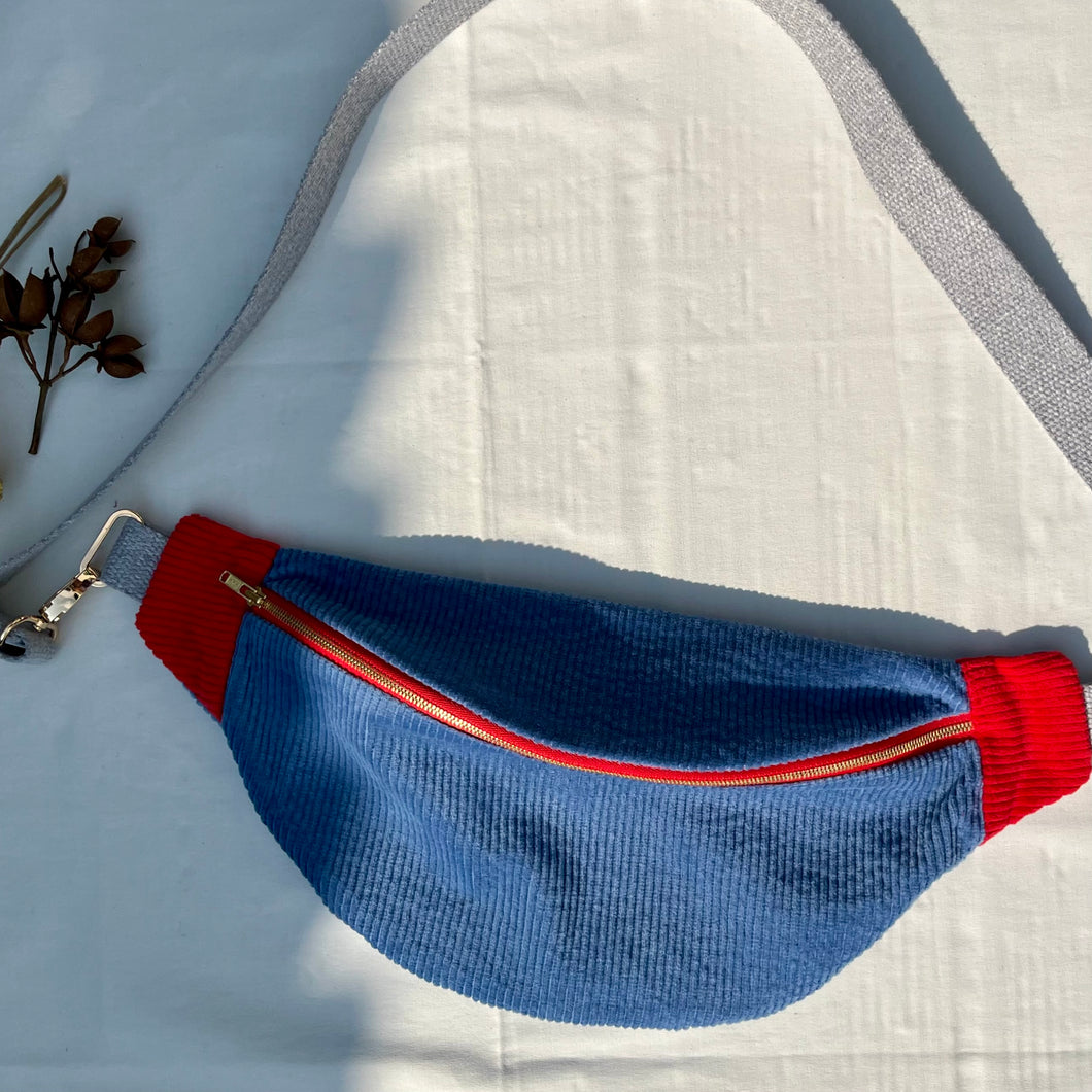 One-of-a-kind tote sling bag. Gorgeous blue and red corduroy. Lined with a blue and black striped cotton poplin fabric.